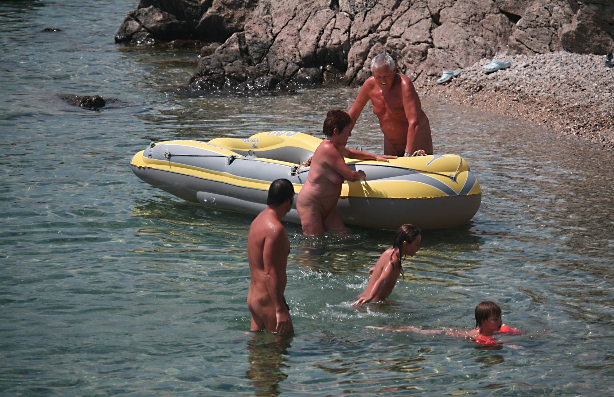 Lone Nudist in Yellow Boat - Purenudism Boy