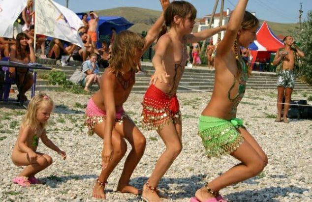 Family nudism of a photo - competition of dances of young nudists |