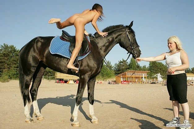 Young nudists in nature learn to ride on horseback video | NakedBody
